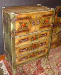 Large Highboy with three drawers below two doors with strap hinges concealing two interior drawers.